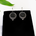 Boucles d’oreilles argenté aux pierres verte